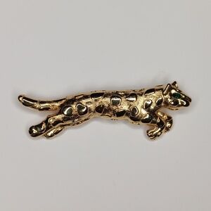 Vintage Trifari spotted gold leopard tiger brooch with green rhinestone eye